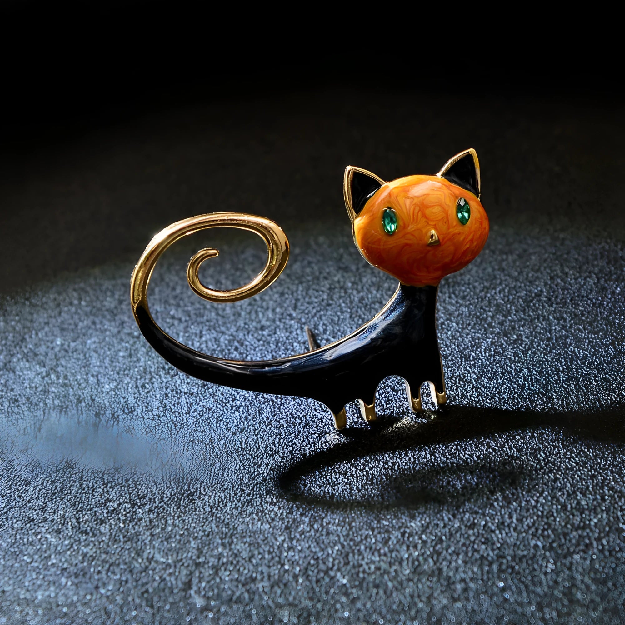 White and orange alloy cat brooch with a painted tailing up kitty design.