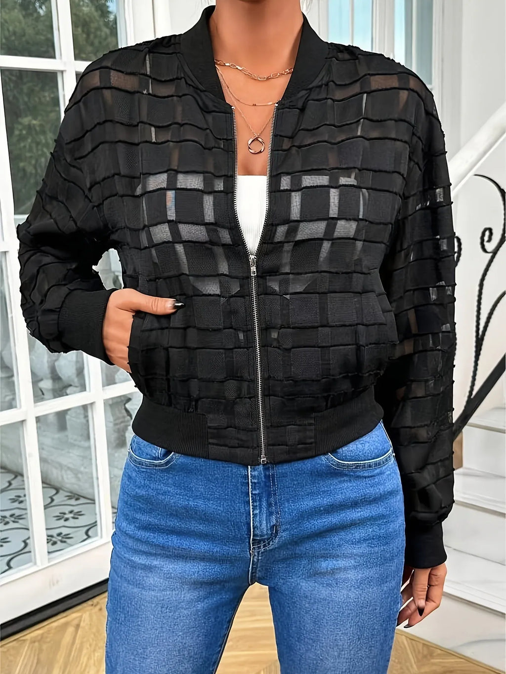 Black women's casual jacket with geometric pattern and front zipper.