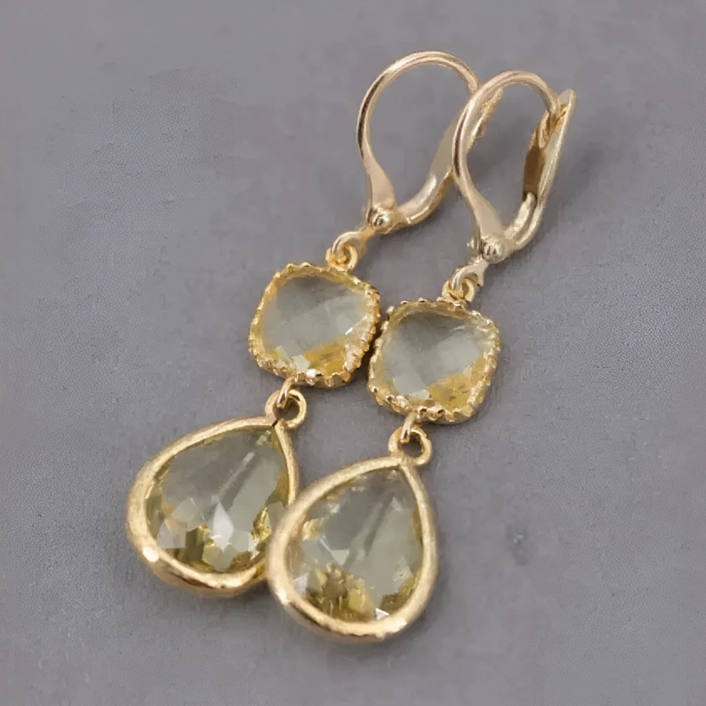 Gold retro geometric earrings with long crystal fringe and water droplet design.