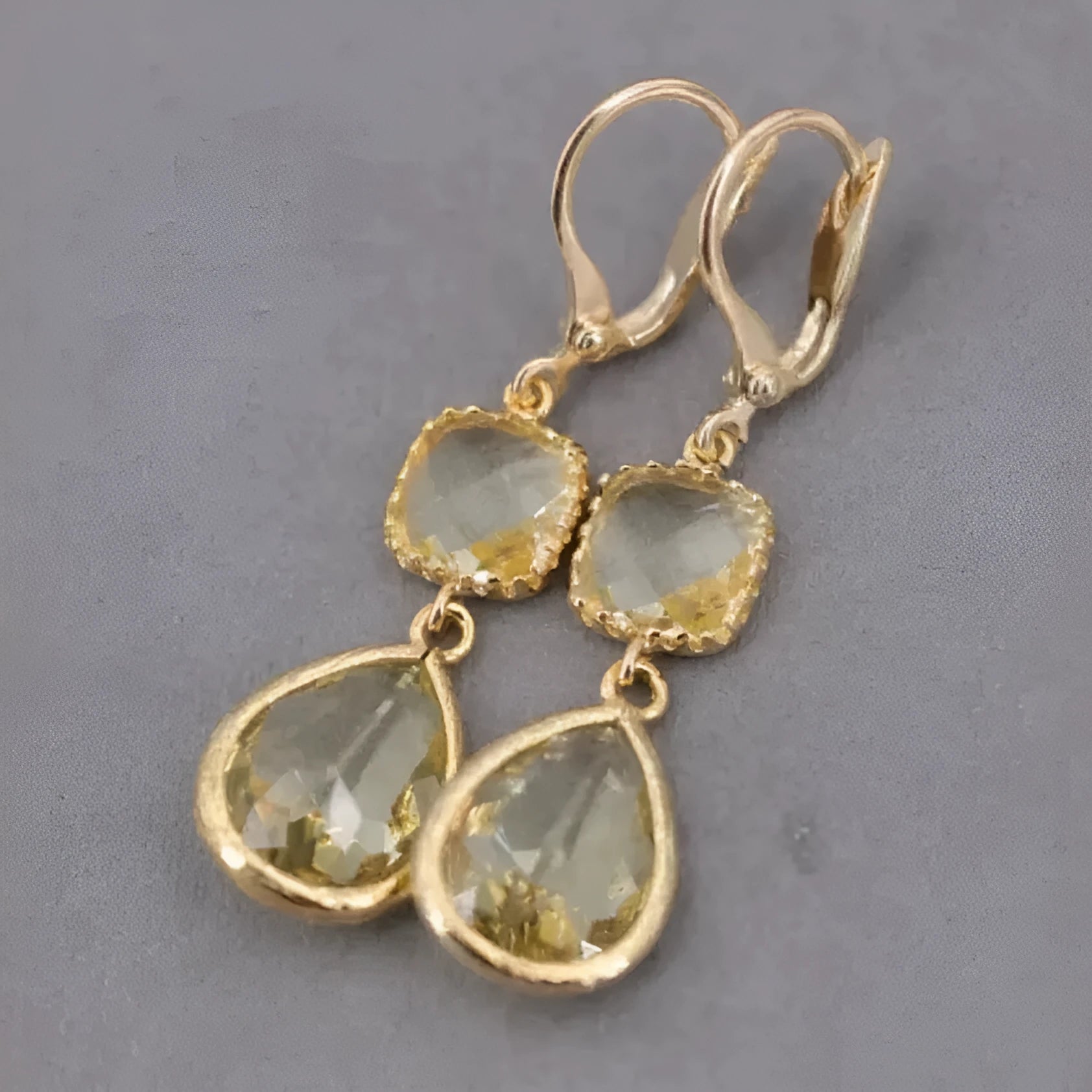 Gold retro geometric earrings with long crystal fringe and water droplet design.