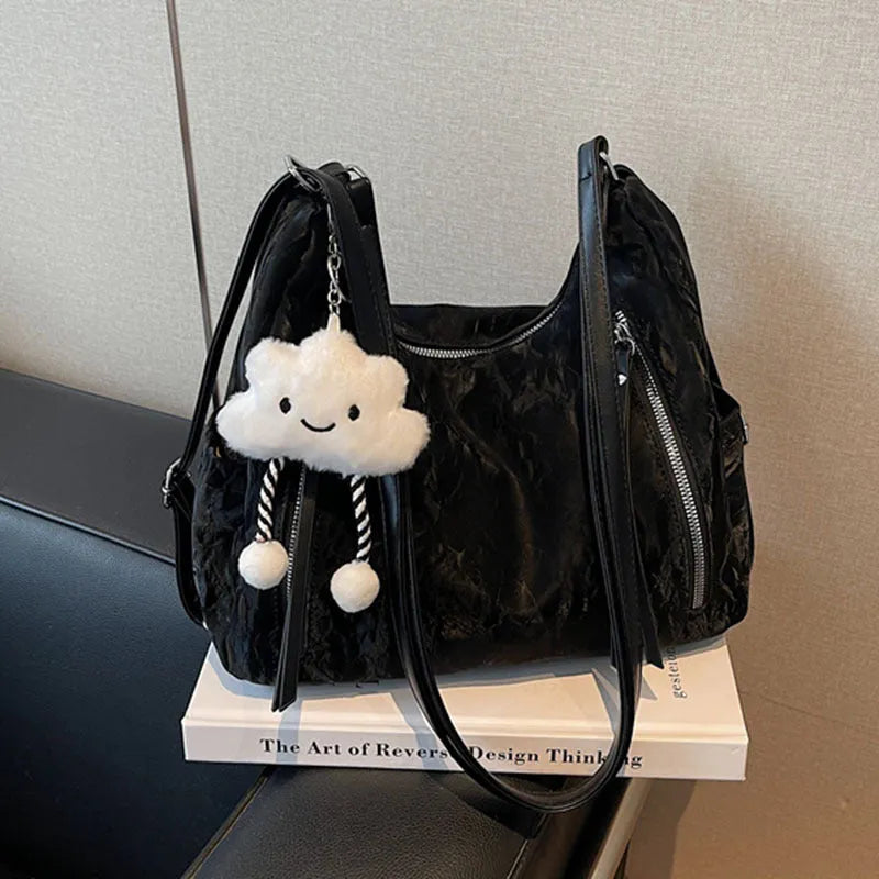 Women's soft PU fashion backpack in black with pendant accessory