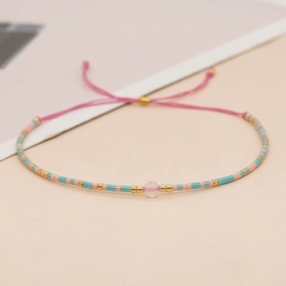 Handmade bohemian-style bracelet with colourful geometric glass beads for women.