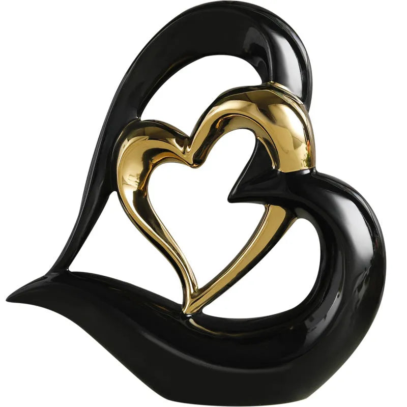 Modern geometric love heart ornament in white porcelain with metallic finish on display surface