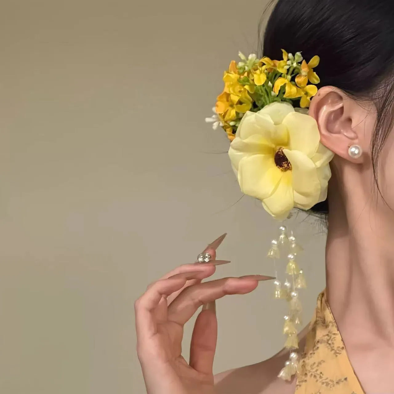 Women's floral tassel hair accessory with side clip in purple or yellow colour options