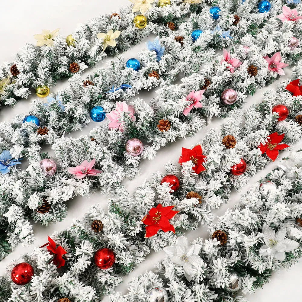 PVC Christmas rattan garland with flocked decoration in golden colour, draped to show texture and length.
