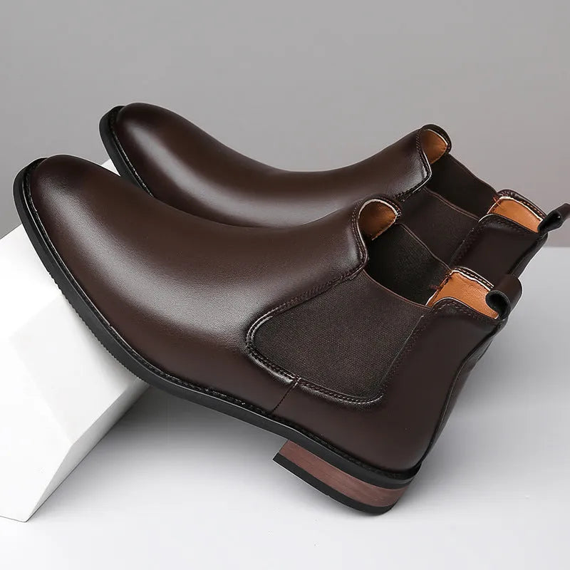 Men's black pointed toe Chelsea boots with artificial PU leather upper and decorative stitching