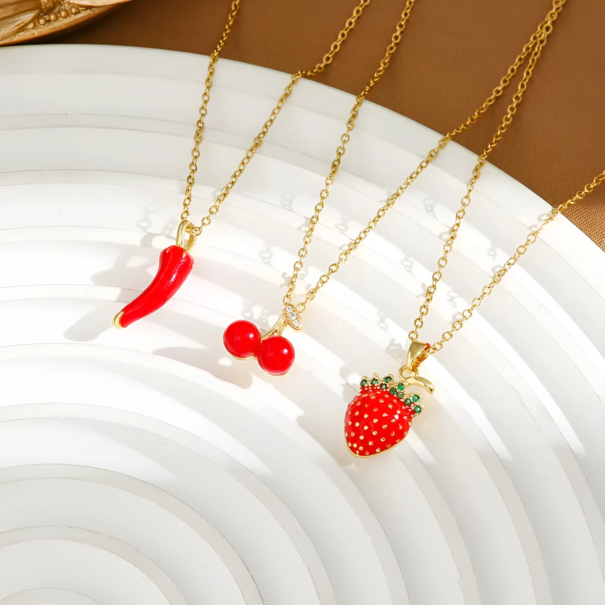 Delicate titanium steel necklace with a small cherry charm on an O-ring chain.