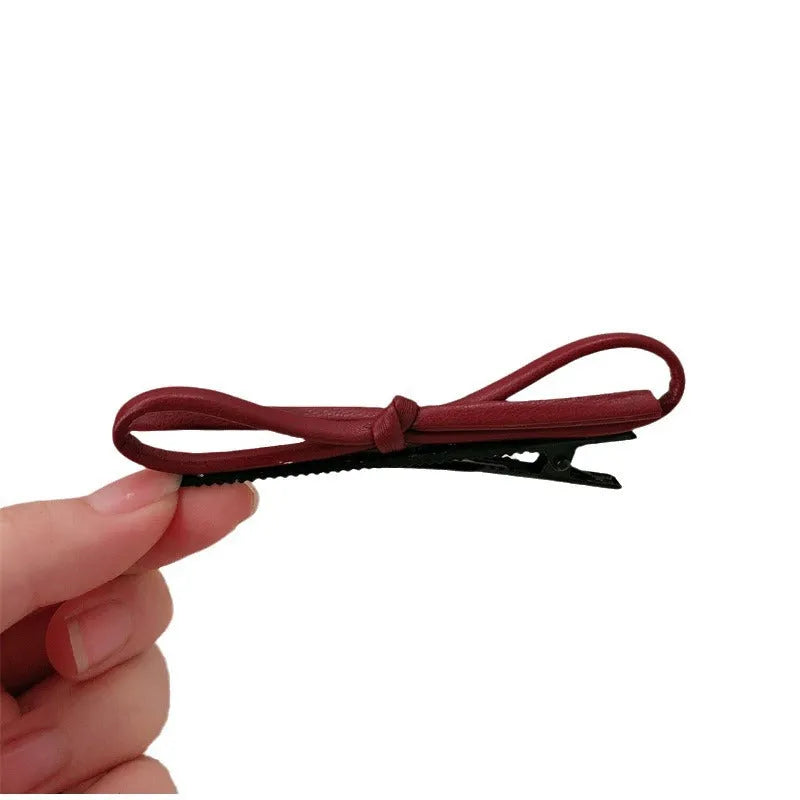 Wine red leather bow hair clip barrette showing advanced bow design and clip mechanism