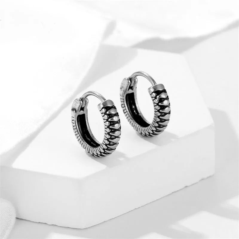 Geometric retro twist stainless steel earrings with stripe design in silver colour