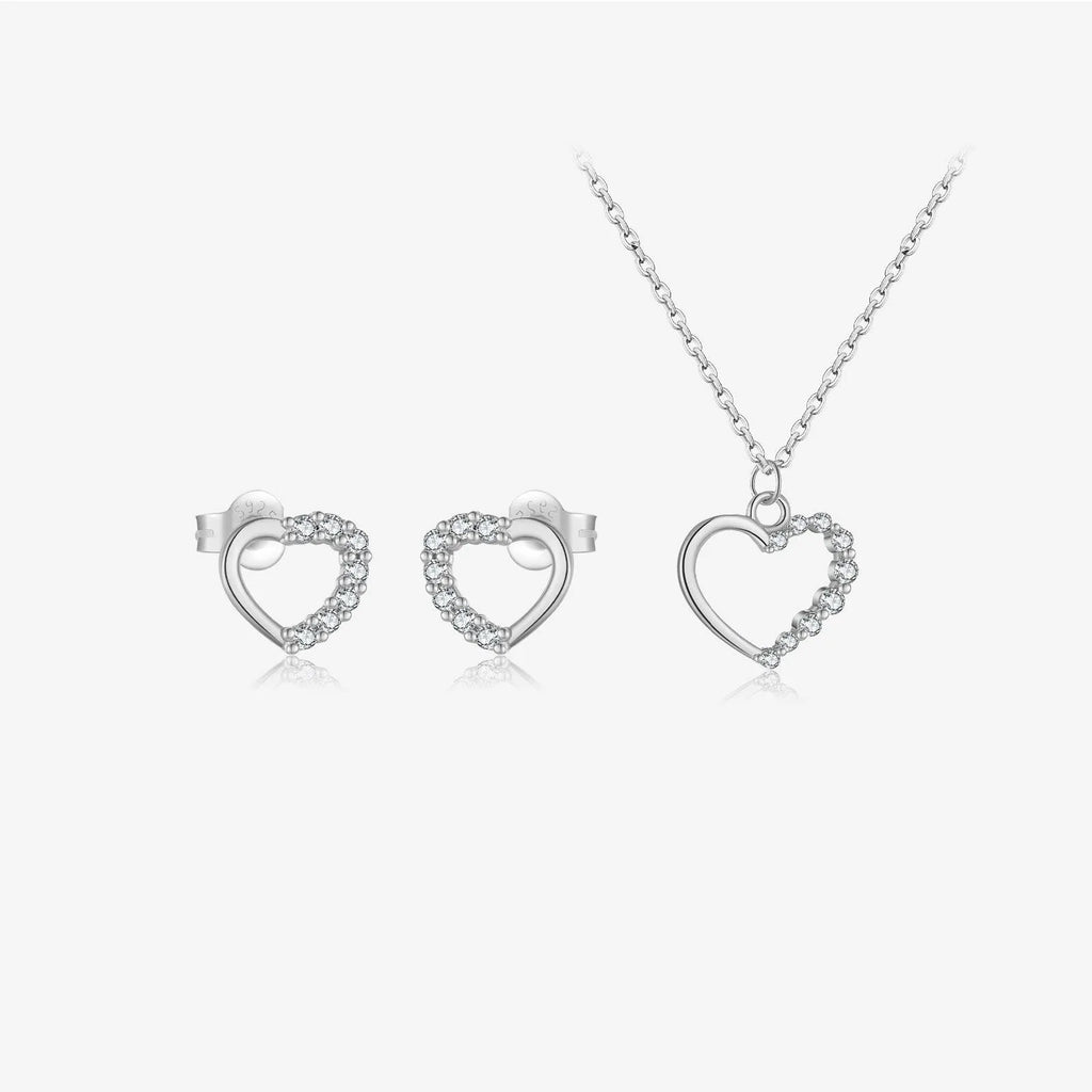 Sterling silver hollow heart and circle pendant necklace on a regular chain, shown in a gold tone finish.