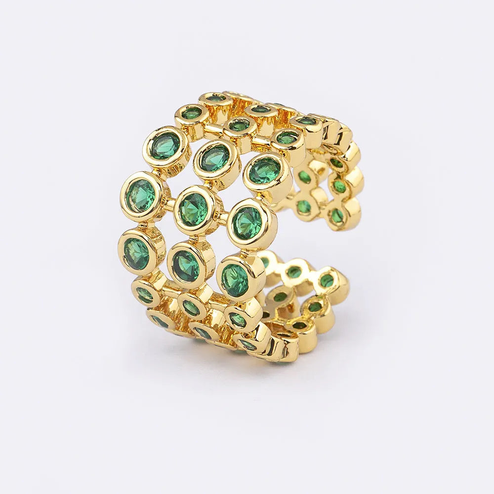 Gold coloured wide band ring with green zircon stones and three-layer copper plating