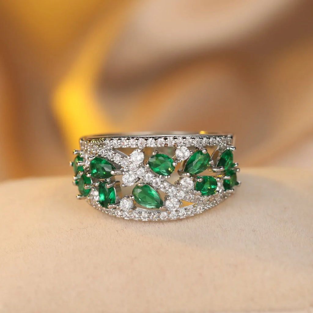 Women's round hollow fashion ring in copper with gold or platinum plating and blue or white accents