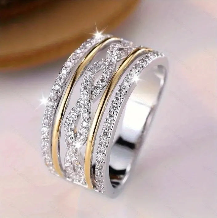 Platinum alloy wide face ring with hollow jeweled detailing, diamond treatment finish, women's ring