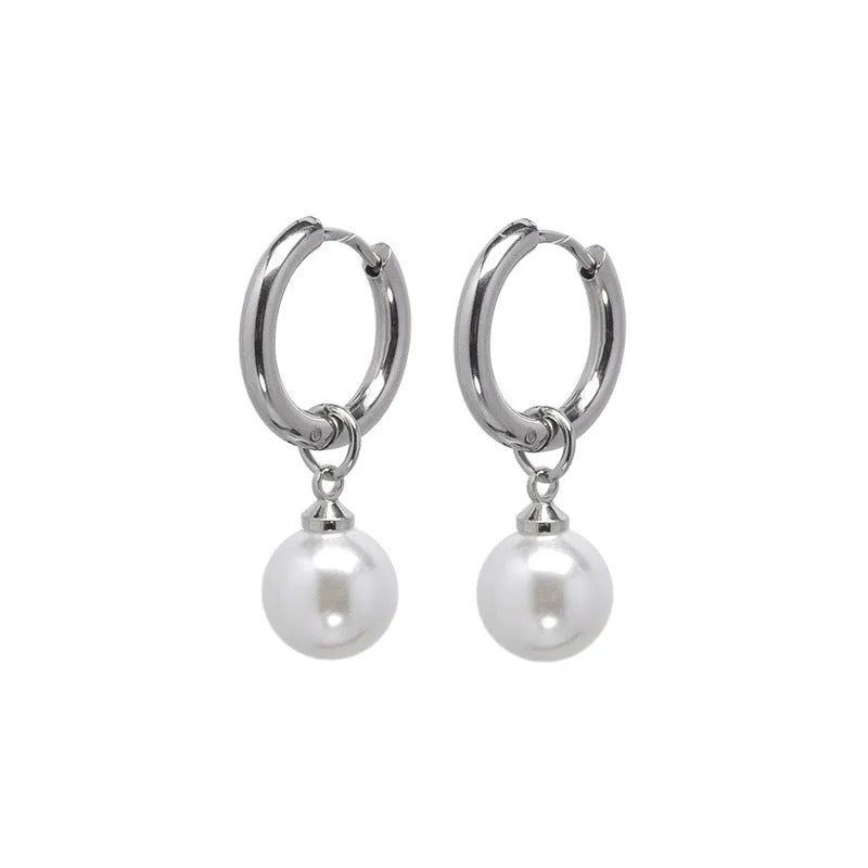 A pair of women's geometric round pearl drop earrings with a titanium steel finish and alloy construction.