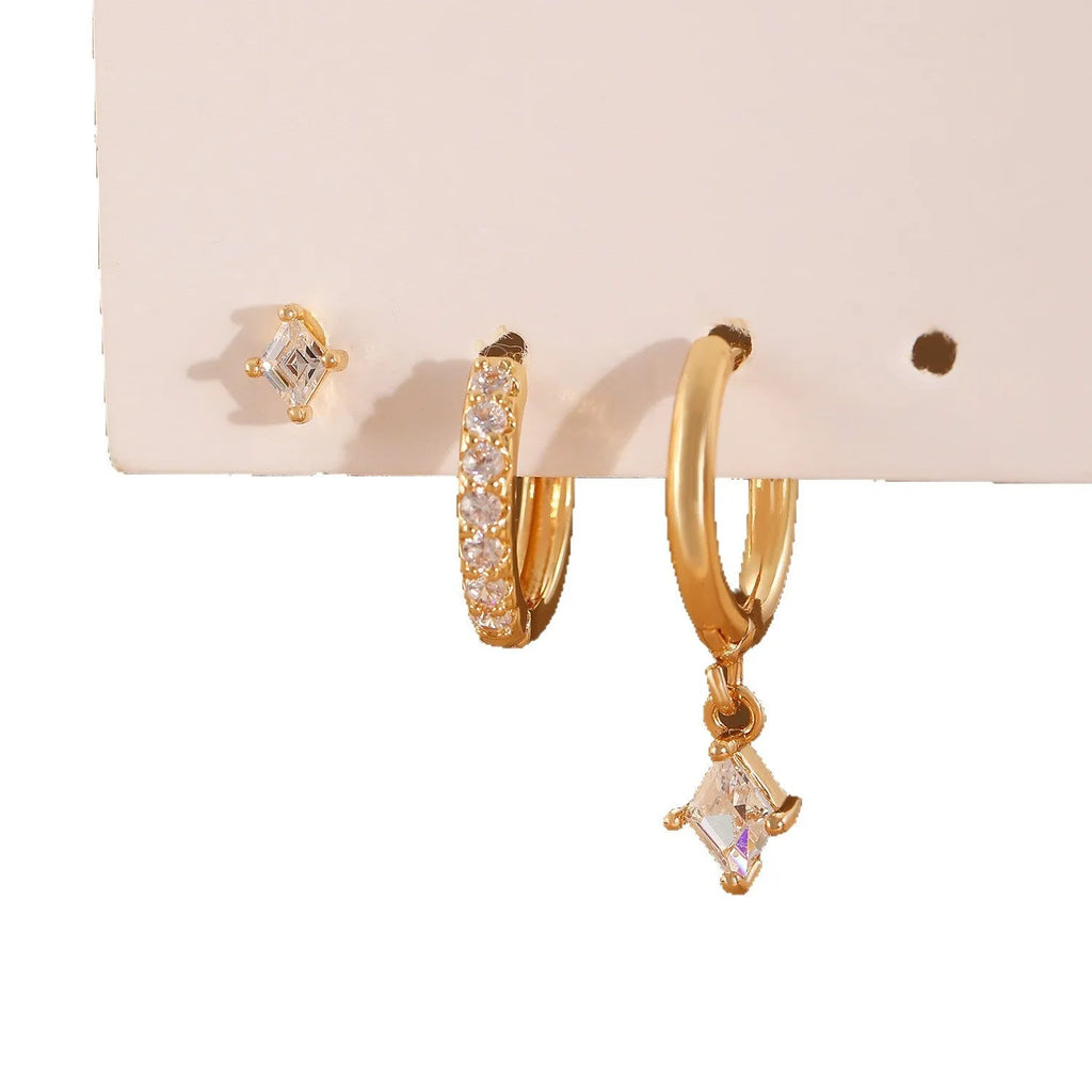 Three-piece geometric earrings set with inlaid zircon detailing on copper in gold and white colours