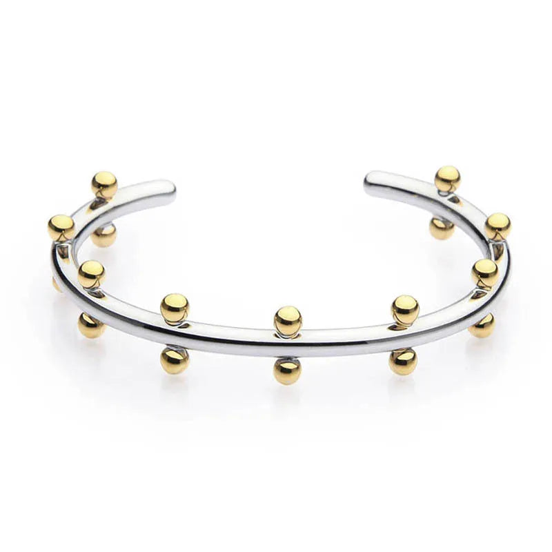 Stainless steel C-shaped bean bead bracelet with textured rivet finish on an alloy chain.