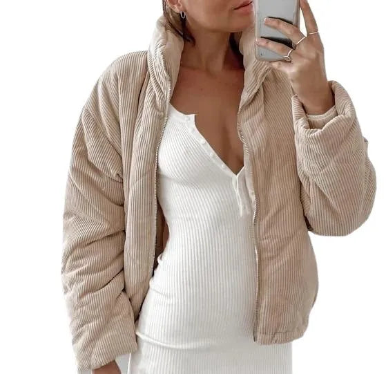 Apricot coloured women's corduroy jacket with stand collar and front zip, showing textured fabric detail