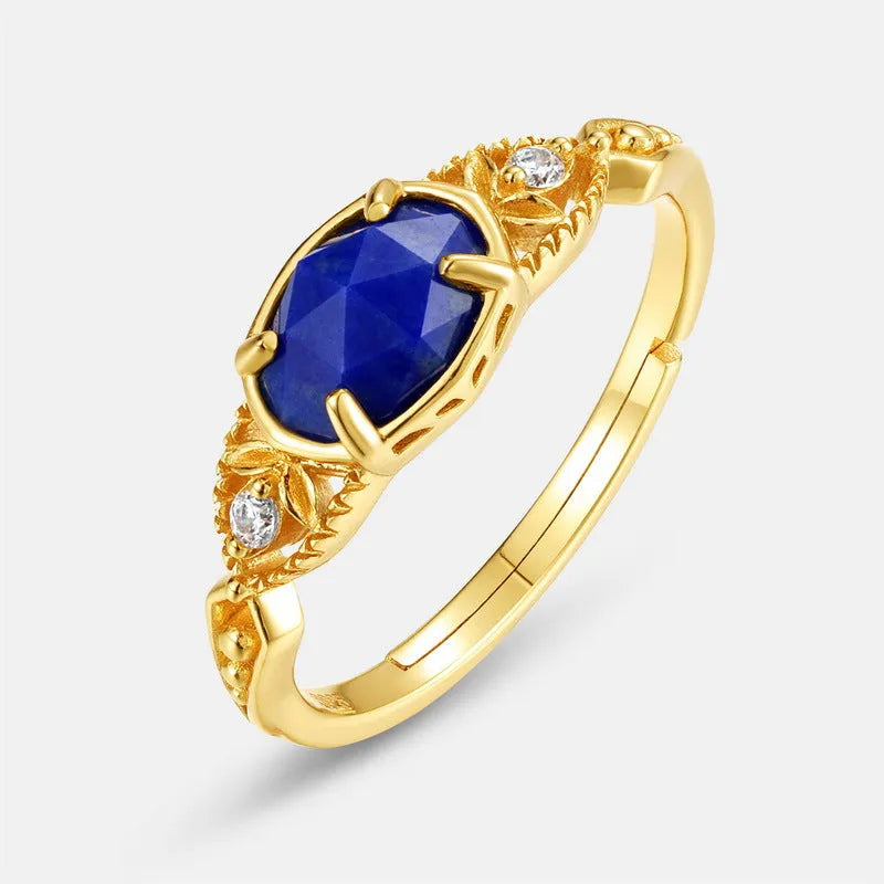 Women's ellipse geometric ring with round blue Lapis Lazuli stone on silver alloy band.
