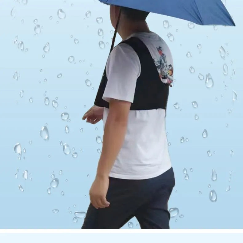Black portable umbrella holder with a shoulder strap for beach sunshades, shown next to a manual umbrella