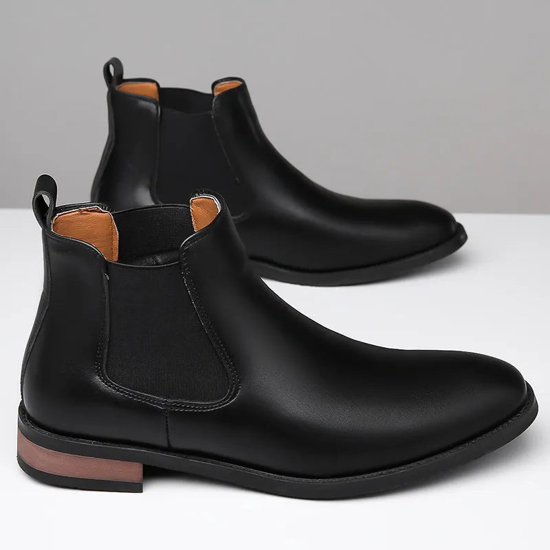 Men's black pointed toe Chelsea boots with artificial PU leather upper and decorative stitching