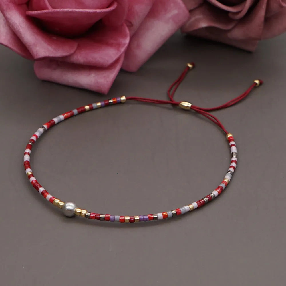 Handmade bohemian-style bracelet with colourful geometric glass beads for women.