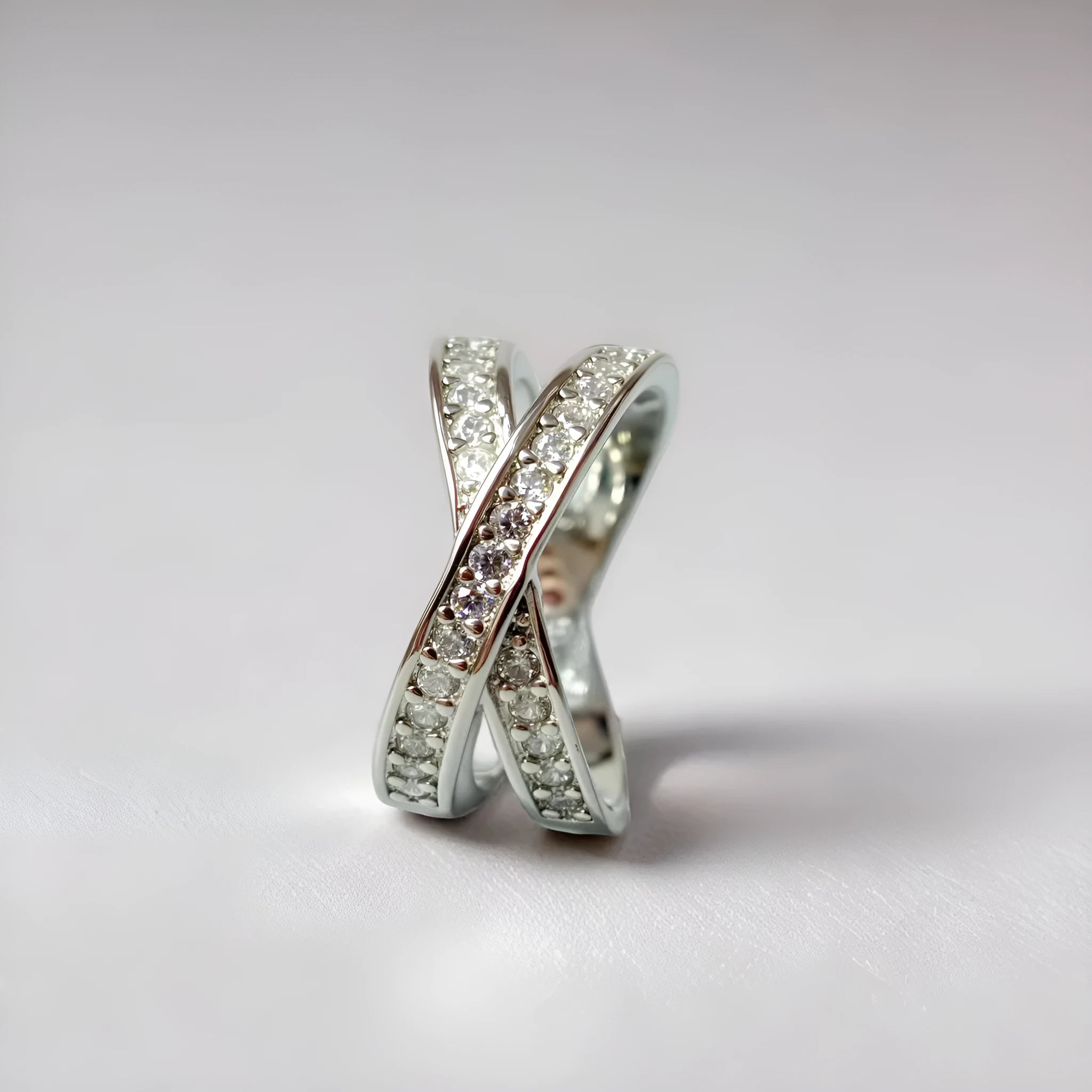 Metal cross ring with micro-inlaid zircon detailing in silver or rose gold electroplate finish