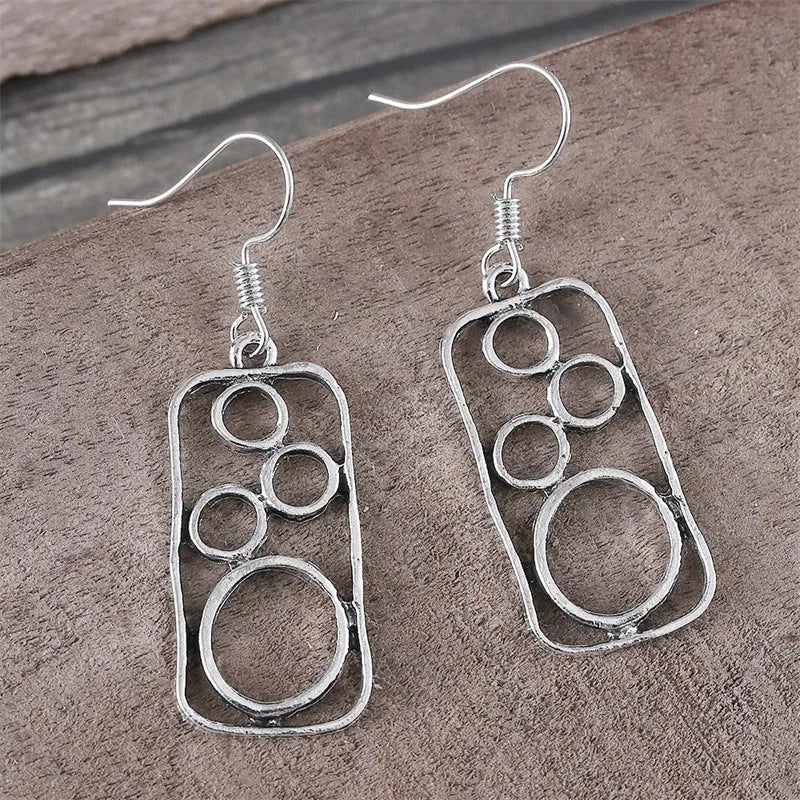 Geometric irregular square zinc alloy earrings with antique silver finish.