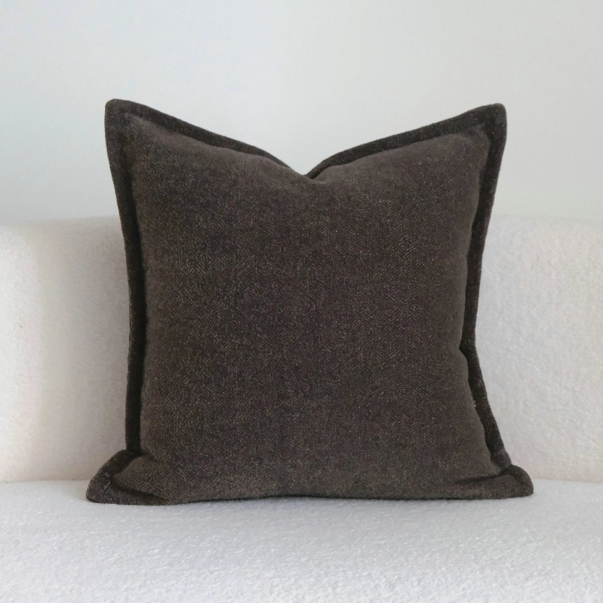 Coffee brown striped Chinese classical style pillow cushion on a sofa, shown in both square and waist pillow sizes.