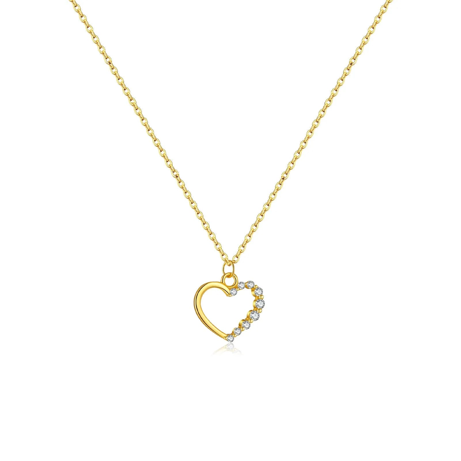 Sterling silver hollow heart and circle pendant necklace on a regular chain, shown in a gold tone finish.