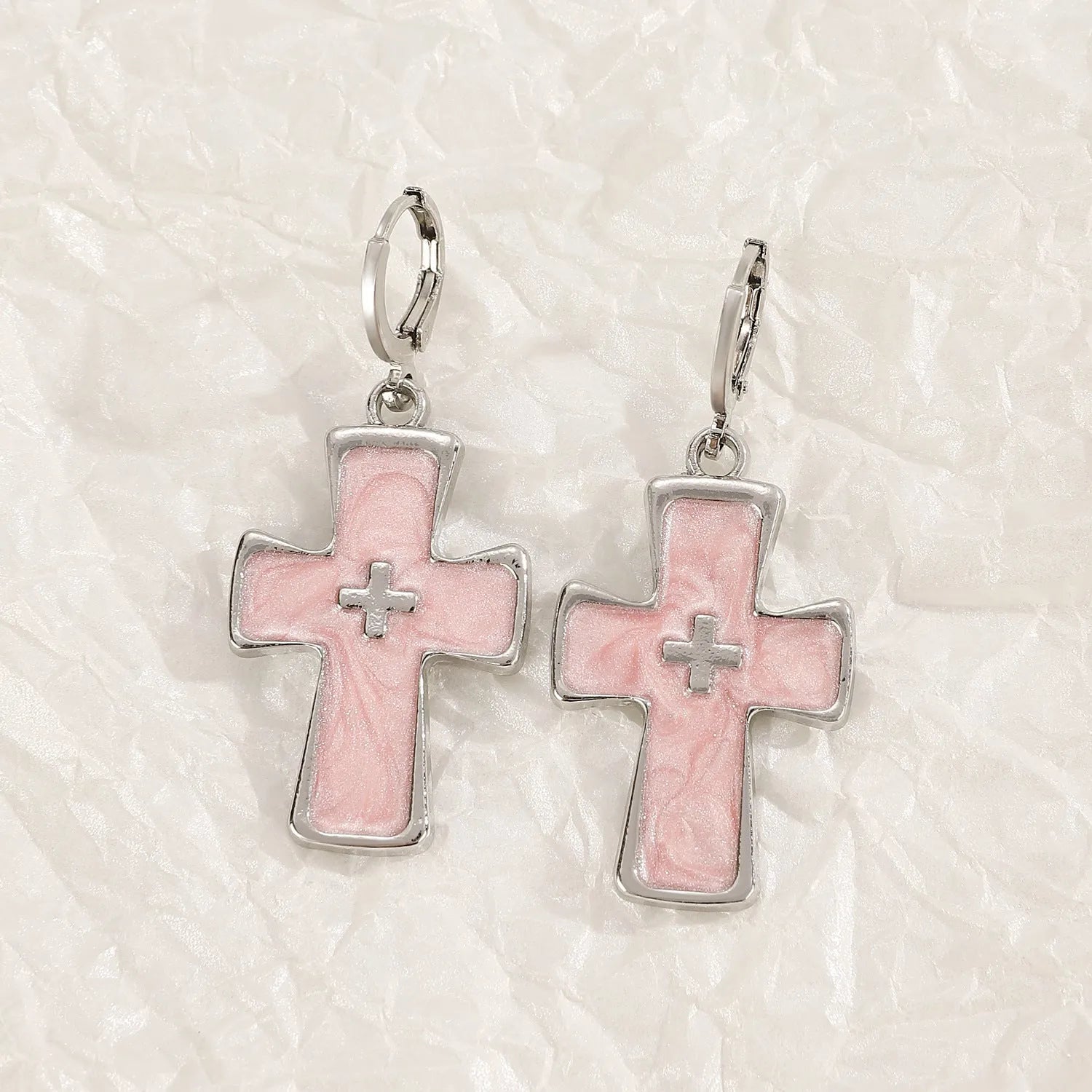 Women's alloy drop earrings featuring cross, heart, and cat charms in white, black, and antique silver finishes.