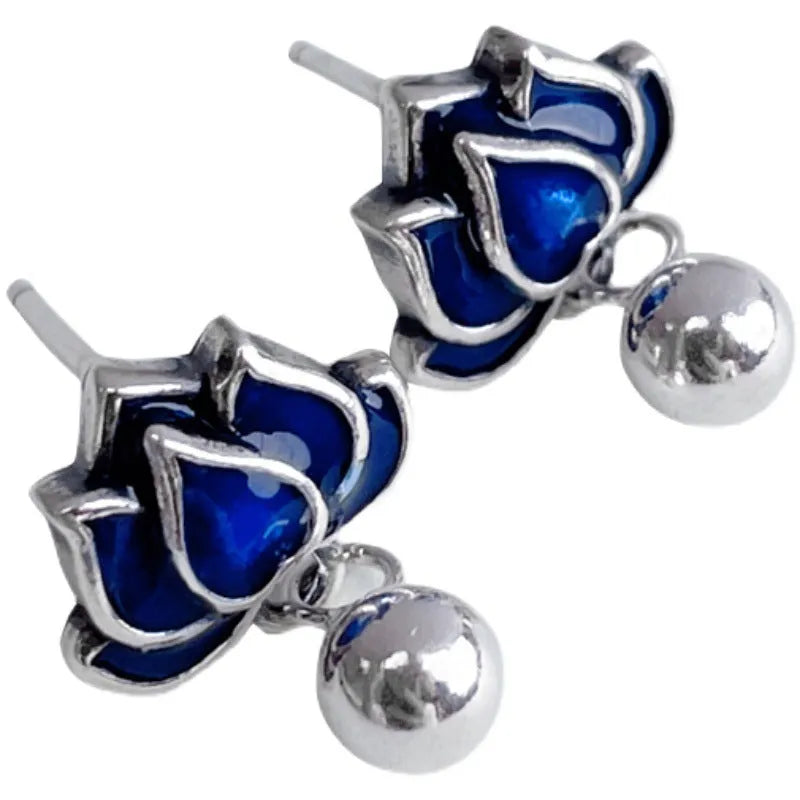 A pair of blue lotus flower alloy ear studs with a retro tassel design.