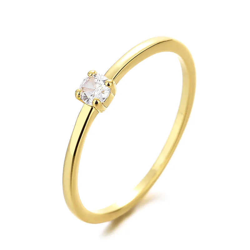 Copper geometric circle ring for women with a single diamond detail, shown in multiple colour options.
