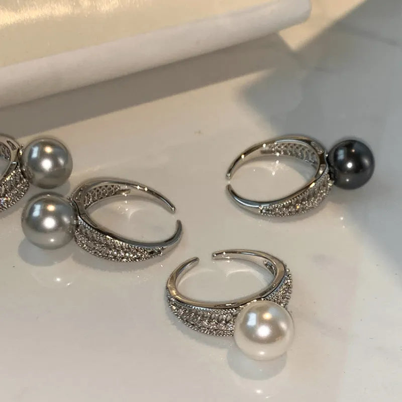 Adjustable black pearl copper ring with geometric open design for women