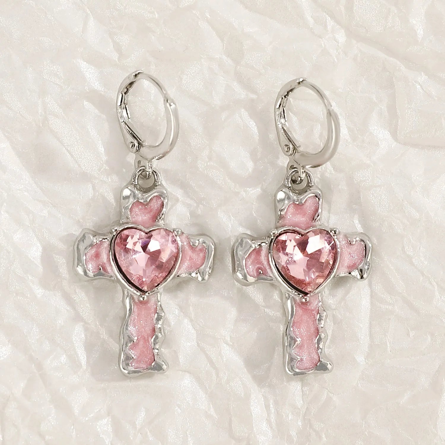 Women's alloy drop earrings featuring cross, heart, and cat charms in white, black, and antique silver finishes.