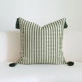 Green cotton and linen tassel hotel sample pillow with botanical patterns on a brushed fabric case