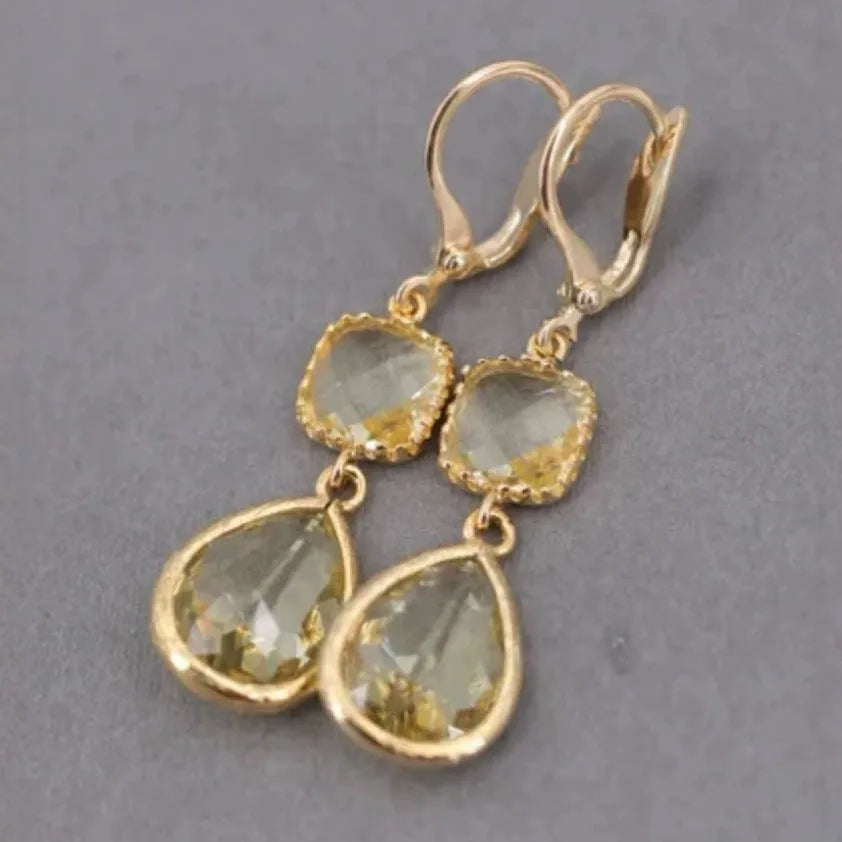 Gold retro geometric earrings with long crystal fringe and water droplet design.