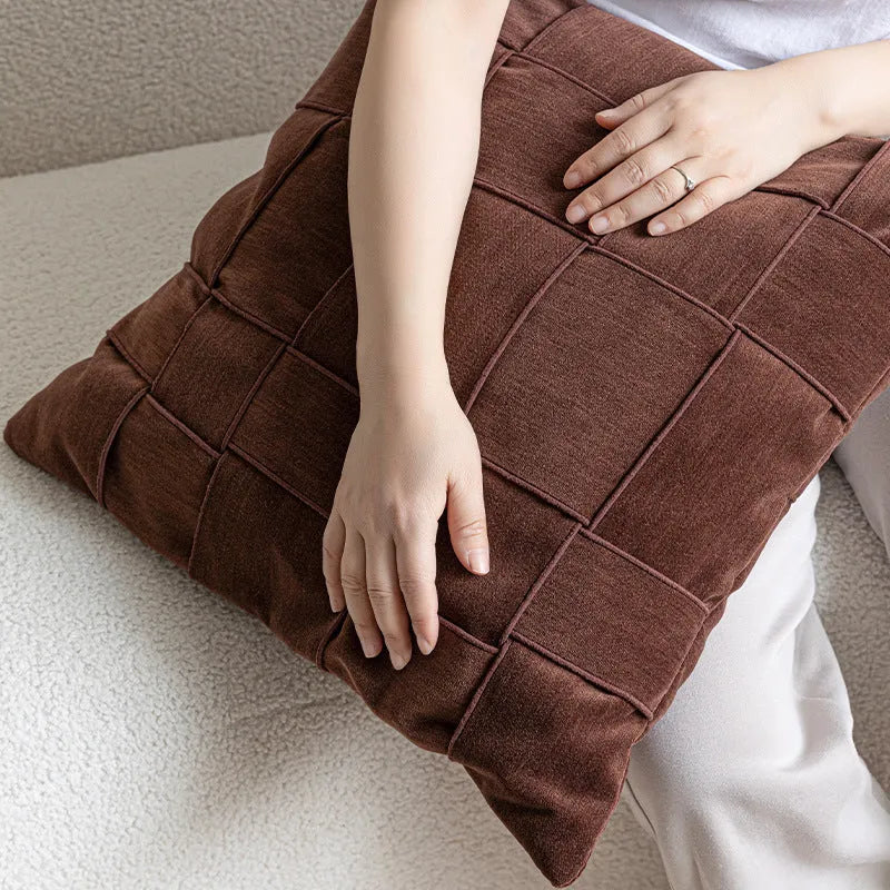 Square chenille woven cushion in beige colour on a grey sofa, 50x50cm size.