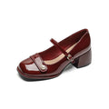 Plus size women's chunky heel pumps in patent leather with a square toe and front buckle, shown in apricot colour.