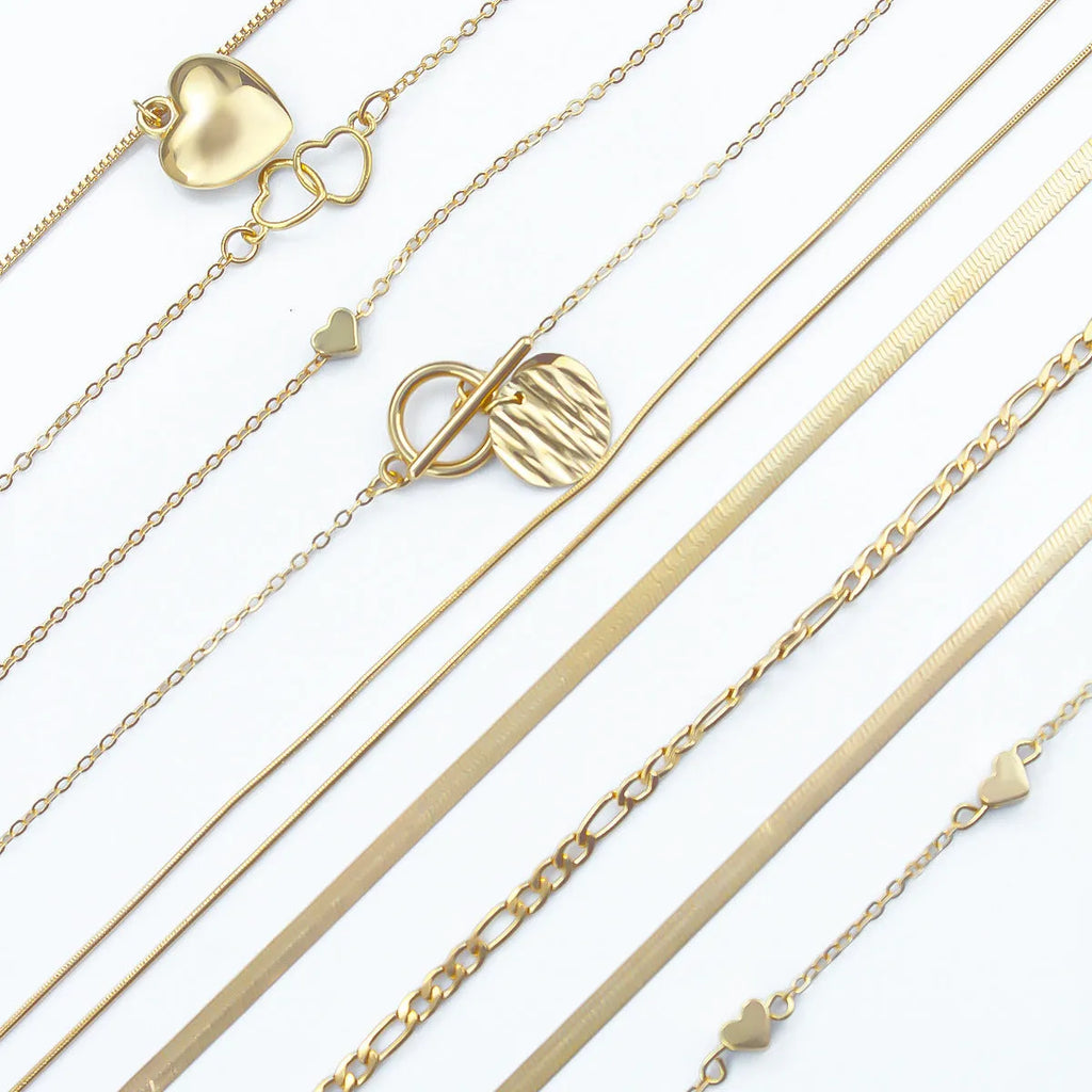10-piece gold electroplated women's necklace set with alloy pendants on adjustable snake bone chain