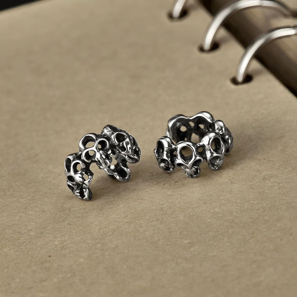 Stainless steel hollow skull design earrings with electroplated GE990-steel ear clips.
