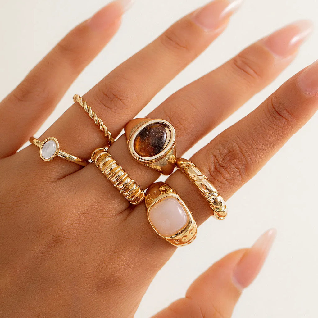 Light gold geometric irregular ring set with six different alloy rings