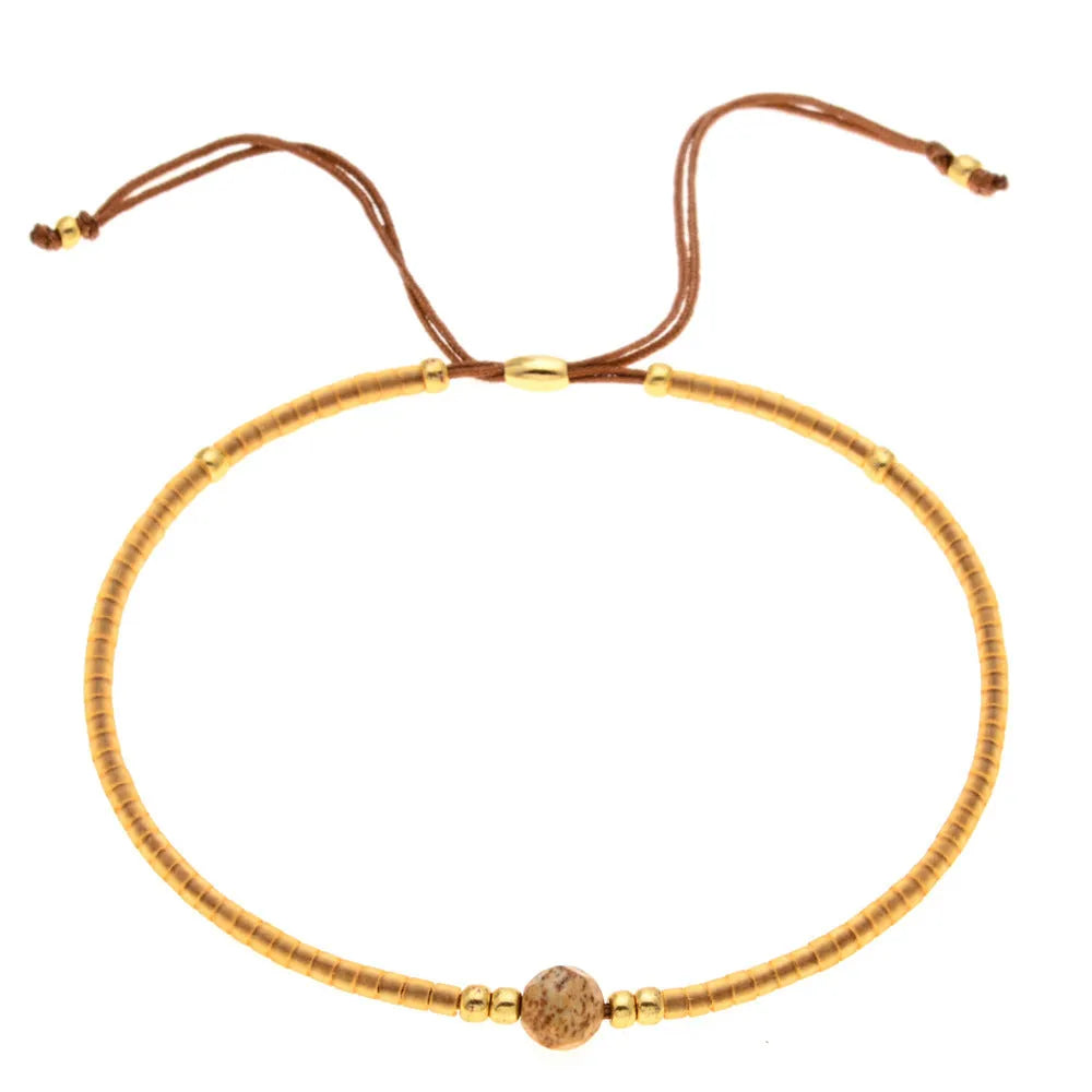 Handmade bohemian-style bracelet with colourful geometric glass beads for women.
