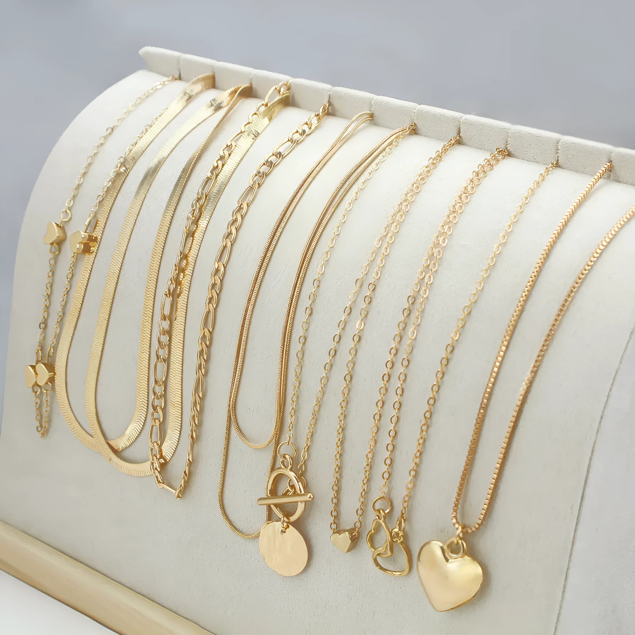 10-piece gold electroplated women's necklace set with alloy pendants on adjustable snake bone chain