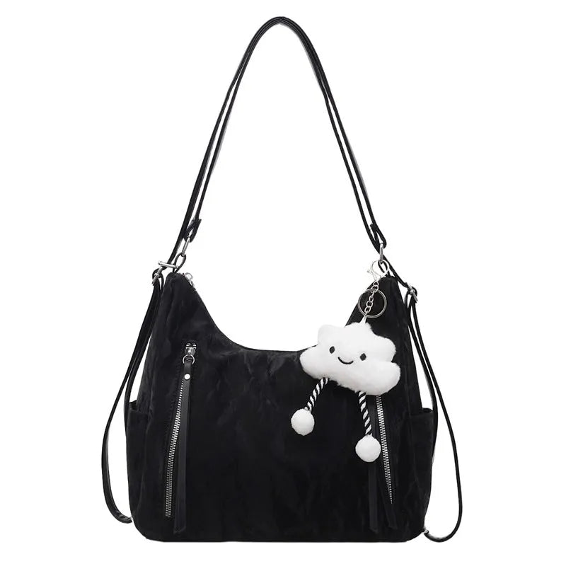 Women's soft PU fashion backpack in black with pendant accessory