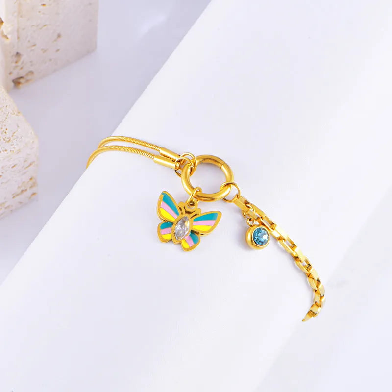 Epoxy butterfly jewellery set with gold colour titanium steel necklace and bracelet