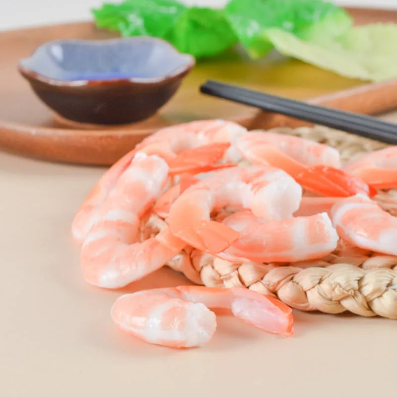 Detailed PVC simulation shrimp keychain bag charm on a white background.