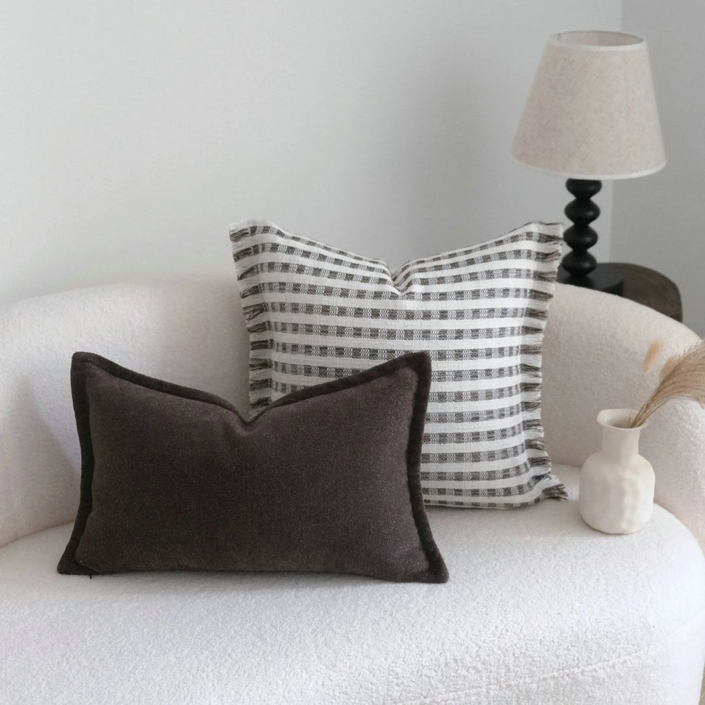 Coffee brown striped Chinese classical style pillow cushion on a sofa, shown in both square and waist pillow sizes.