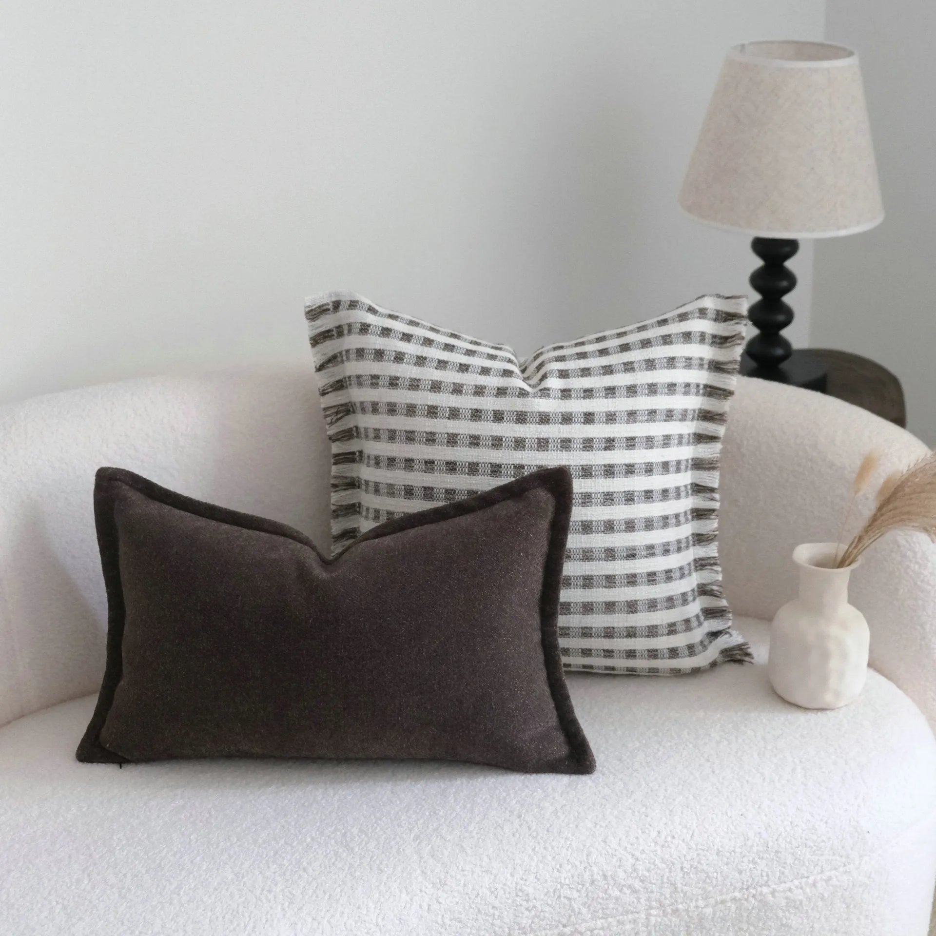 Coffee brown striped Chinese classical style pillow cushion on a sofa, shown in both square and waist pillow sizes.