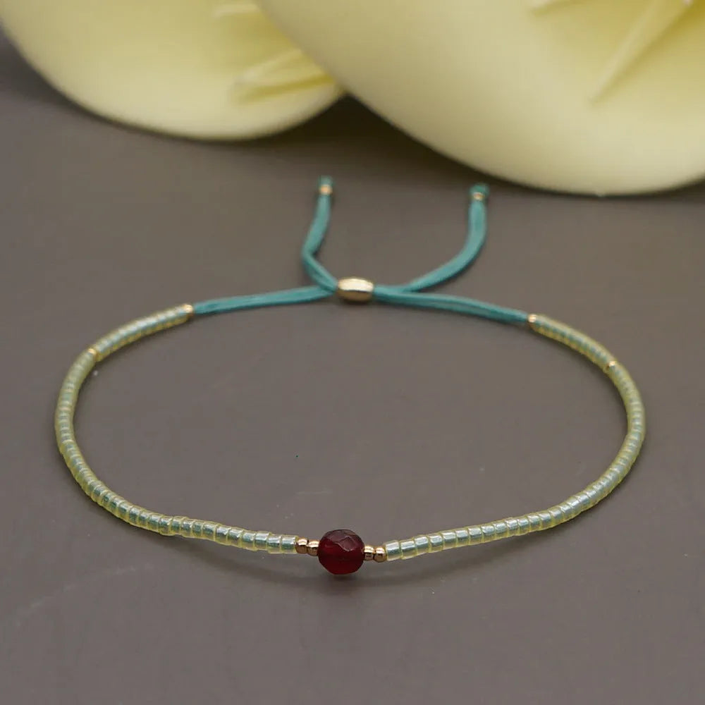 Handmade bohemian-style bracelet with colourful geometric glass beads for women.
