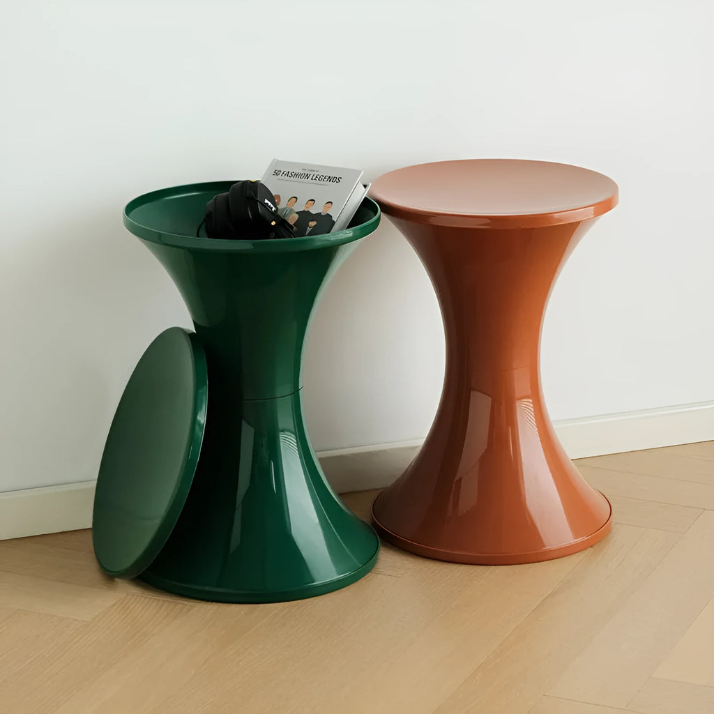 Plastic hourglass-shaped shoe changing stool in selected colour, shown in a home entryway setting.
